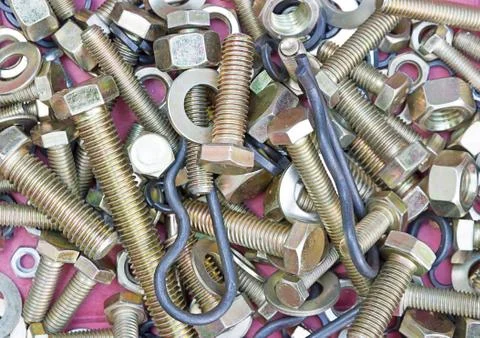 Background of screws and nuts. Stock Photos