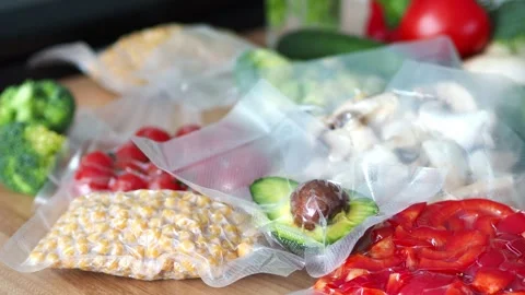Background with sealed vegetables. Set of ingredients. Optimizing space in the k Stock Footage 303696876