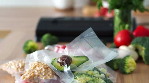 Background with sealed vegetables. Set of ingredients. Optimizing space in the k Stock Footage 303696891