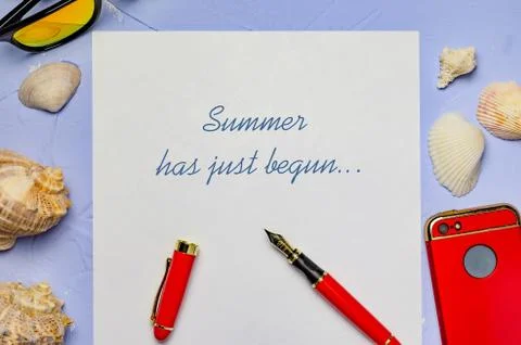 Background with seashells a white sheet of paper with the inscription pen red Stock Photos