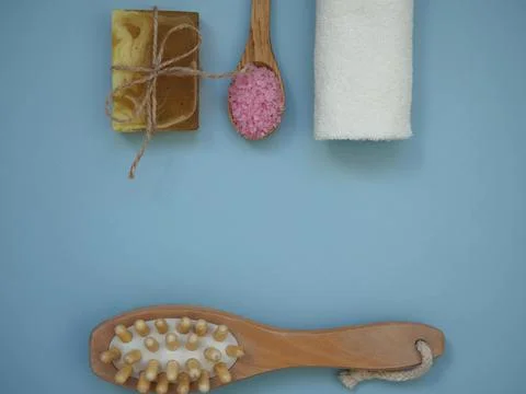 Background with a set of items for spa body skin care treatments on a blue Stock Photos