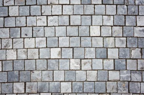 Background of sett. Cobblestone pavement. Texture. Fotos Stock