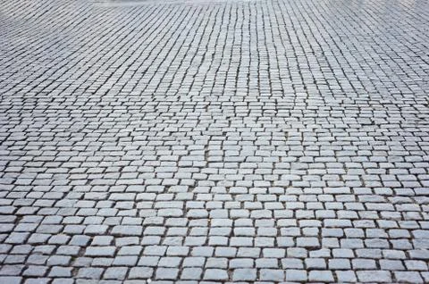 Background of sett. Cobblestone pavement. Texture. Stock Photos
