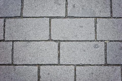 Background of sett. Cobblestone pavement. Texture. Stockfoto's