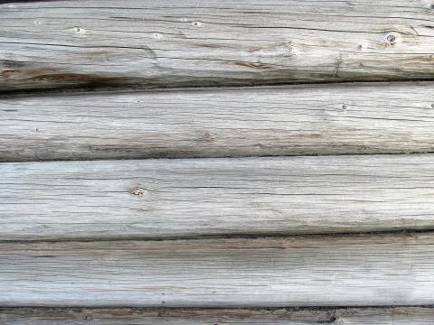 Background of several rows of old pine logs. Stock Photos