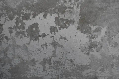 The background of a shabby concrete wall. Texture of peeling concrete. Backdrop Stockfoto's