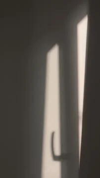 Background with shadow from a window on a white painted wall Stock Photos