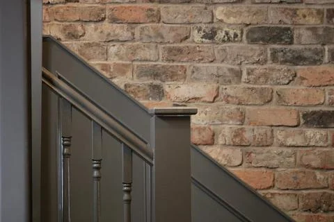 Background showing rustic brick wall and stairs with bannisters copy space Stock Photos