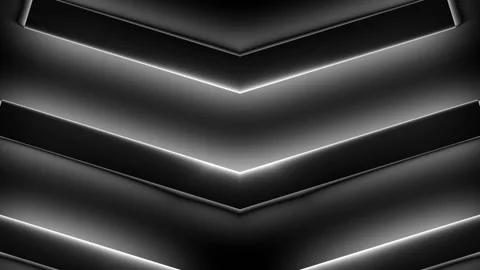 Background shows a dark design with black bars in the shape of arrows moving Stock Footage 160655459