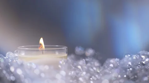 Background of Single Candle Lit with Lens Flare on Christmas Decoration Stock-Footage 128818713