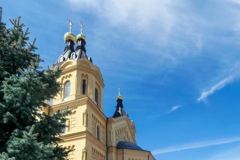 On the background of sky with clouds seen an Orthodox Church with Golden dome Stock Photos