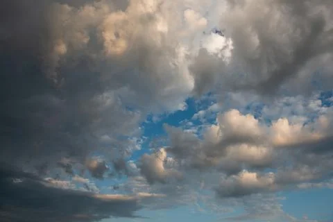 Background sky texture with darker clouds on a blue sky Stock Photos