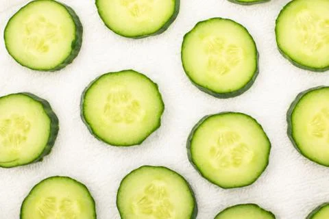 Background from sliced cucumbers Stock Photos