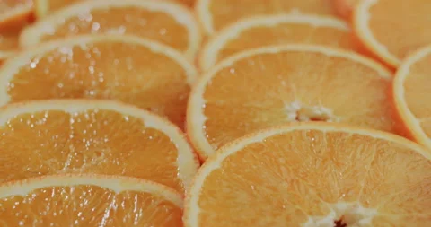 The background of the sliced slices of orange Stock Footage 149942412