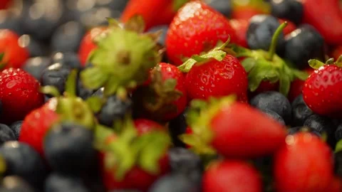 Background slow motion video of cherries and blueberries falling on berries. Stock Footage 278828316