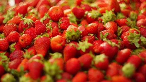 Background slow motion video of strawberry falling on red berries. Stock Footage 278314530