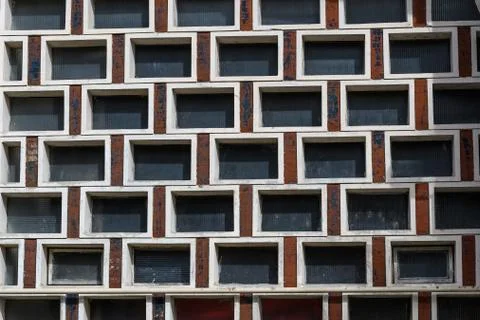 Background with small dirty windows on a wall, white frames Stock Photos