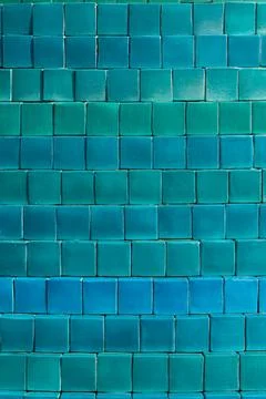 Background of small square tiles in different shades of blue and green Stock Photos