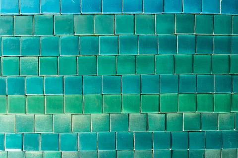 Background of small square tiles in different shades of blue and green Stock Photos