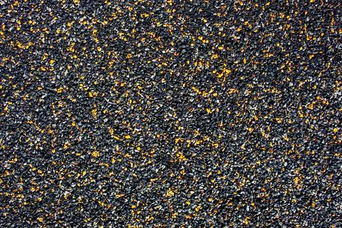 Background from small stone chips of black and orange colors Stock Photos