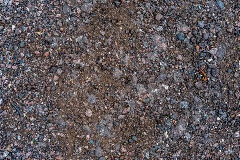 Background of small stones and broken asphalt. Stock Photos