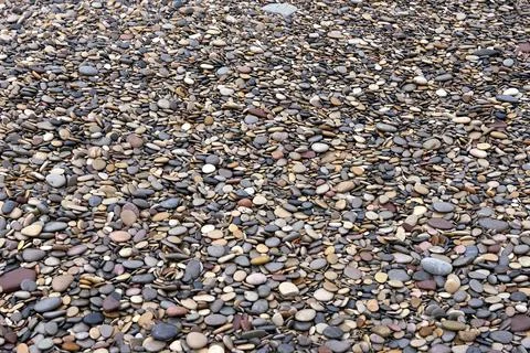Background of small stones from the beach Stock Photos