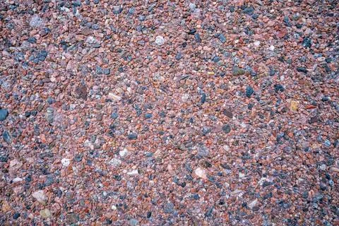 Background of small tiny colored pebbles. Background of pebbles of differen.. Stock Photos