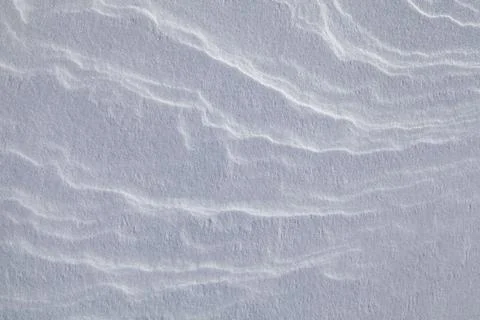 Background of the snow texture with waves. Stock Photos