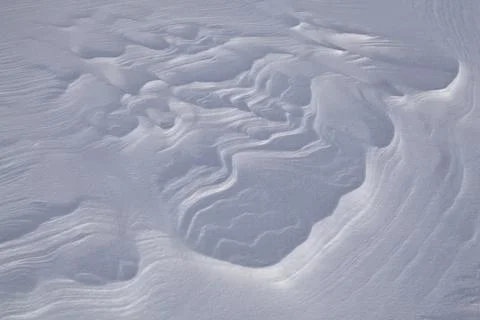 Background of the snow texture with waves. Stock Photos