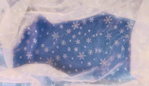 Background: snowy material on a blue background. Stock Photos