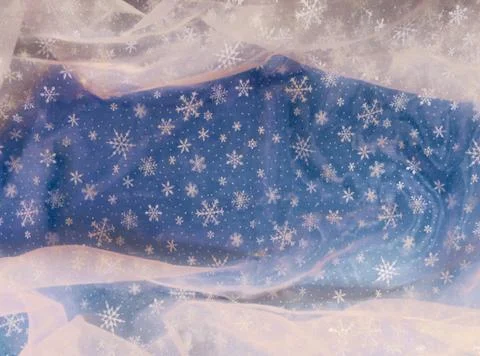 Background: snowy material on a blue background. Stock Photos