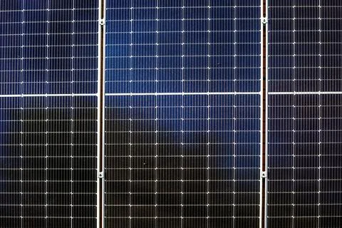 Background from solar panels located vertically on a sunny day. Natural ene.. Stock Photos