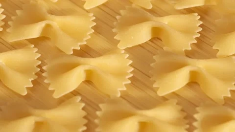 Background Of Spaghetti Pasta. Uncooked Italian Pasta Golden Rotating Backdrop Stock-Footage 197658486