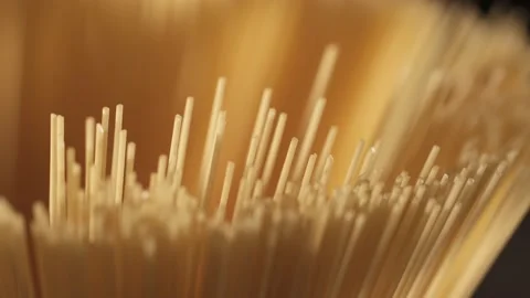 Background Of Spaghetti Pasta. Uncooked Italian Pasta Golden Rotating Backdrop Stock Footage 200451644