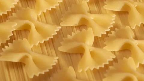 Background Of Spaghetti Pasta. Uncooked Italian Pasta Golden Rotating Backdrop Stock Footage 200800789