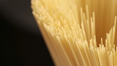 Background Of Spaghetti Pasta. Uncooked Italian Pasta Golden Rotating Backdrop Stock Footage 201391553