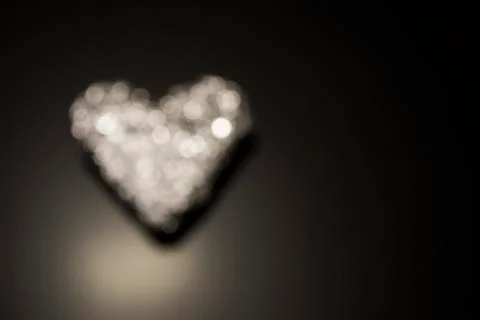 Background with a sparkling heart on black background, classic Stock Photos
