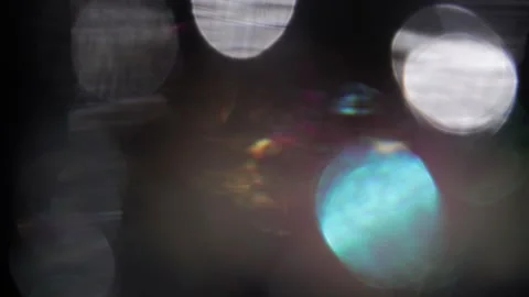 Background of sparkling lights covered with colored light bokeh Vidéo 318576716