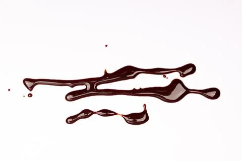 Background of splash and flow drops of chocolate Stock Photos