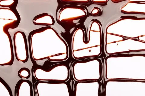 Background of splash and flow drops of chocolate Stock Photos