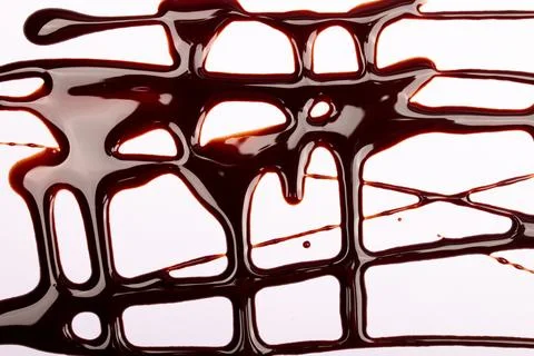 Background of splash and flow drops of chocolate Stock Photos