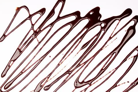 Background of splash and flow drops of chocolate Stock Photos