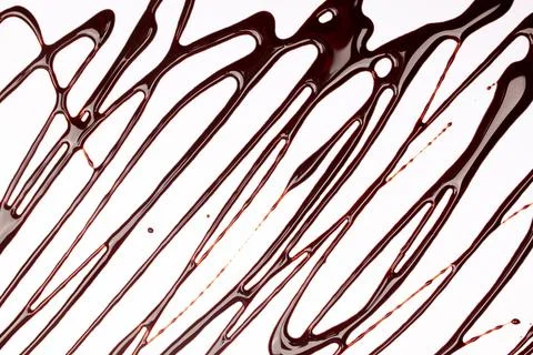 Background of splash and flow drops of chocolate Stock Photos