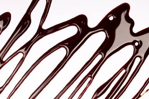 Background of splash and flow drops of chocolate Stock Photos