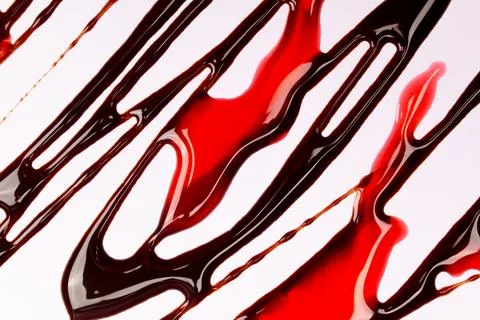 Background of splash and flow drops of chocolate Stock Photos