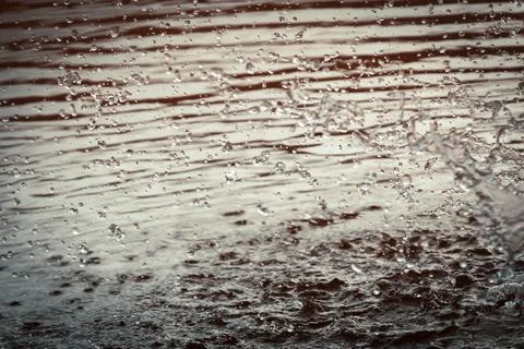 Background with splashes and drops of water in the lake, river or sea. Stock Photos