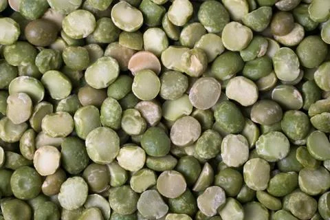 A background of split dry green peas. Stock Photos