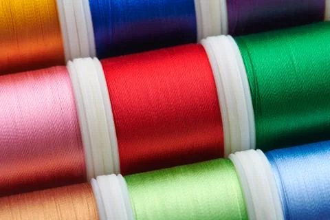 Background from spools with multicolored sewing threads Stock-Fotos