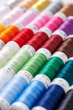 Background from spools with multicolored sewing threads Stock-Fotos