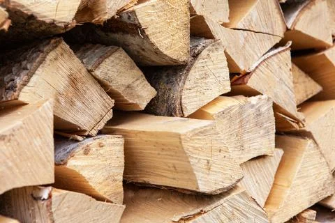 Background from stack of firewood from birch tree, for heating house, stacked Stock Photos